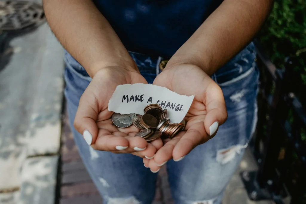 woman holding coins in her hands